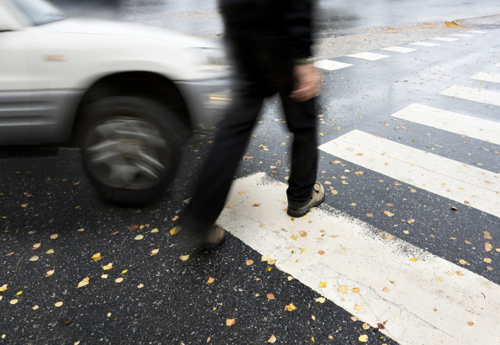 Car nearly hitting pedestrian at Irvine crosswalk