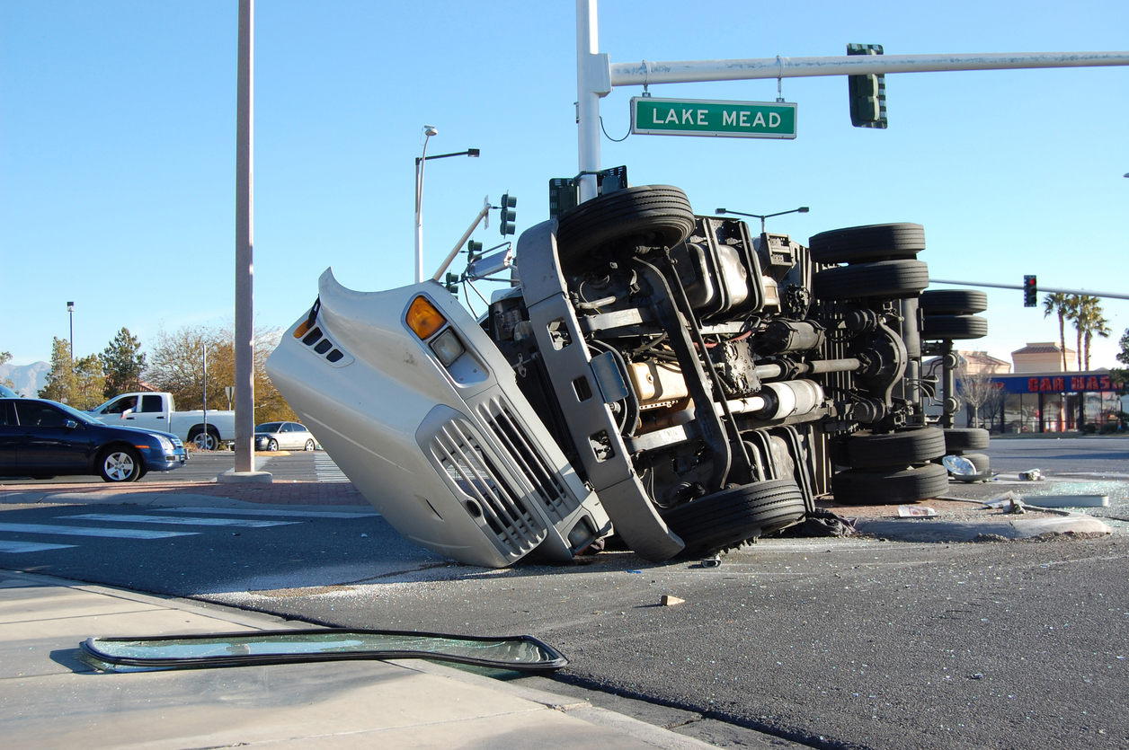 Overturned truck accident in Irvine, highlighting injury damages